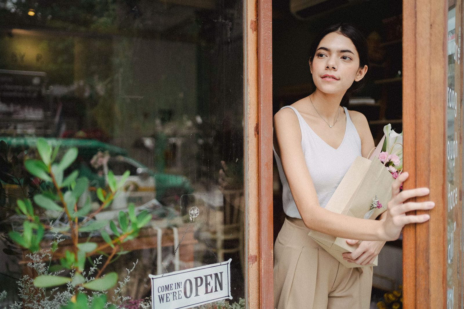 Flower shop customer holding a bouquet
